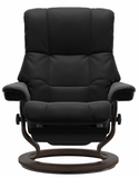 Black recliner chair with wooden base.