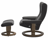 Gray recliner chair with ottoman on 