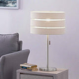 Table lamp with beige shade and silver base