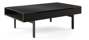 Ready to give any occasion a lift, the Reveal coffee table’s top glides to a comfortable height for seated use. Whether used for working from the sofa or enjoying snacks in front of the TV, the satin-etched glass top provides a comfortable surface. Lower compartments keep stored items within convenient reach. The partnering side table features three levels of storage.