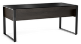 The clean lines and refined styling of the Corridor 6521 Executive Desk are pleasing to the eye and engineered and designed to keep you organized, efficient, and inspired. Topped with durable soft-to-the-touch satin-etched tempered glass, the 6521 includes a hidden flip-front keyboard drawer, cable management channels, and a modesty panel for comfortable cross-desk collaboration. 