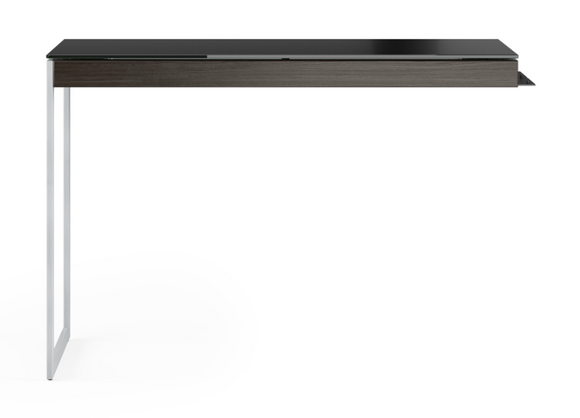 Partnered with the Sequel 6101 Desk, or used alone as a compact laptop desk when connected to a compatible Sequel storage cabinet, the Sequel 6112 Desk Return provides a slim and highly functional workspace. The understated frame maneuvers easily to coordinate with other pieces, bringing exceptional versatility to a small office space. The satin-etched glass top and elegant hardwood veneer make the Return decidedly stylish, delivering impressive fashion to match its elite functionality.