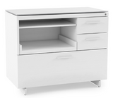Extend your work surface with the Centro Return 6402. The Return attaches to Centro Desk 6401, 3-Drawer File Cabinet 6414, Lateral File Cabinet 6416, and Multifunction Cabinet 6417 with sturdy steel connections, and is topped with a highly durable and uniquely soft grey satin-etched tempered glass surface.