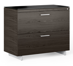 The Sequel 6116 is an attractive locking file cabinet that offers ample storage, and is a convenient and stylish solution for organizing office supplies and important files, whether as a standalone piece or as the base for the Sequel Return. With innovative features such as an anti-tip mechanism and a counterweight for stability, this storage cabinet is topped with beautiful black satin-etched tempered glass resistant to scratches, dings, and fingerprints. 
