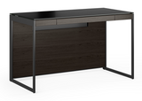 Innovative modern design gives the Sequel 20 Compact Desk bold functionality with seemingly limitless placement options. Designed for smaller spaces—yet full of innovative features—this compact desk includes a multifunctional keyboard drawer and wire management system that helps to provide an organized and efficient workstation in a compact design.