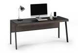 The Sigma 6901 office desk combines sophisticated design with high functionality to create an inspiring and efficient workstation. Packed with a host of innovative features such as magnetically attached modesty panel that neatly conceals wiring, a generously sized built-in keyboard drawer, a cable-management ledge perfectly positioned for a power strip, and an unbelievably soft satin-etched glass top, the 6901 is engineered to be a luxurious modern desk.