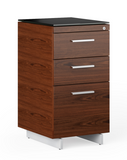 This three-drawer filing cabinet includes two storage drawers for office supplies, a file drawer for letter or legal-sized folders, and can be placed beside a desk to extend the available workspace. Create a slim workstation or laptop desk by partnering it with the 6112 Return.
