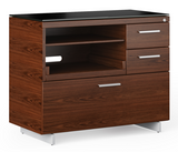 The Sequel 6117 multifunction cabinet is designed to maximize compact office spaces and is designed with convenient features such as a pullout shelf for easy access to a printer, scanner, or all-in-one, an adjustable shelf for paper storage, two storage drawers and a lateral file drawer. This modern file cabinet is topped with highly durable and unbelievably soft black satin-etched tempered glass that resists dings, scratches, and fingerprints.