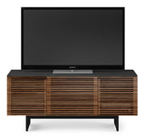 With its striking design, the Corridor 8177 media console combines high functionality with premium style, featuring hardwood louvered doors that keep electronics neatly concealed but always accessible. This modern TV stand also includes an innovative center drawer with a full-width soundbar shelf and ample storage for movies, video games, and other media, all topped with durable satin-etched tempered glass - part of the award-winning Corridor Media Collection.