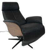 Hjort Knudsen 7600 Balance Recliner with a Black Leather Seat, Lacquered Walnut Side Panels, and a Black Base