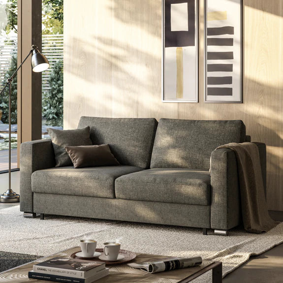 The Fantasy design harbors a secret worth exploring between its track arms and below its loose back cushions. With one simple motion, it converts into a ready-to-use sleeper, in less than one minute.