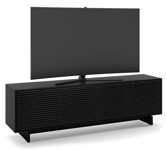 The Align 7479 TV stand features an array of useful and innovative features that make it a must-own media console. Perfectly sized for home theater systems with a large television, this modern TV stand packs a ton of innovative features, including a full-width soundbar shelf, remote-friendly and acoustically-transparent louvered doors, built-in cable management, flow-through ventilation, adjustable shelves, hidden wheels, and rear access panels.